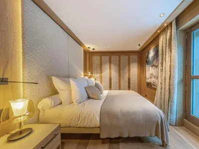 Un ou plusieurs lits dans un hébergement de l'établissement Appartement de luxe 4 pièces 111m² avec terrasse à Val-d'Isère - FR-1-694-425