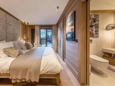 Un ou plusieurs lits dans un hébergement de l'établissement Appartement de luxe 4 pièces 111m² avec terrasse à Val-d'Isère - FR-1-694-425