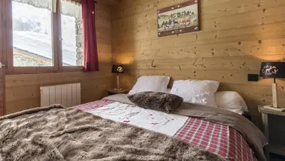Un ou plusieurs lits dans un hébergement de l'établissement Chalet le Névé