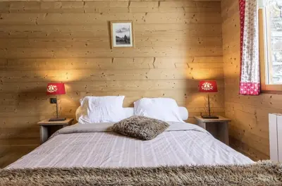Un ou plusieurs lits dans un hébergement de l'établissement Chalet le Névé