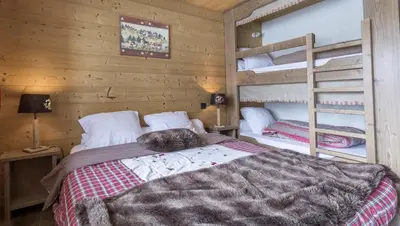 Un ou plusieurs lits dans un hébergement de l'établissement Chalet le Névé