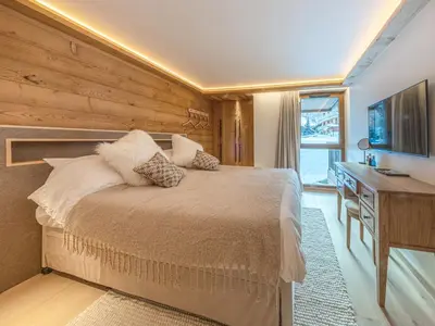Un ou plusieurs lits dans un hébergement de l'établissement Appartement de Standing avec Piscine, Sauna et Hammam à Val-d'Isère - FR-1-694-426
