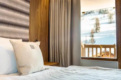 Un ou plusieurs lits dans un hébergement de l'établissement Résidence Alpina Lodge