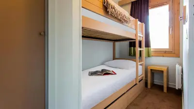 Un ou plusieurs lits dans un hébergement de l'établissement Studio Coin Nuit 4 Personnes MAE-2351