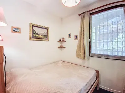 Un ou plusieurs lits dans un hébergement de l'établissement Apartment Le Balcon des Brevières by Interhome