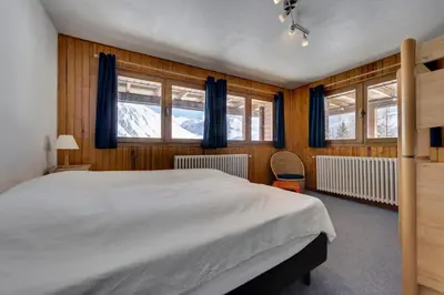 Un ou plusieurs lits dans un hébergement de l'établissement CHALET CROUZE - Chaleureux Chalet, ski au pied - 14 personnes