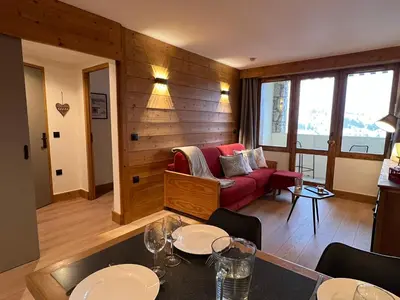 Coin salon dans l'établissement BELLE PLAGNE - LES NEREIDES - Les deux flocons