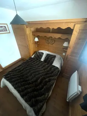 Un ou plusieurs lits dans un hébergement de l'établissement Appartement à la montagne