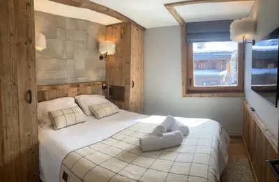 Un ou plusieurs lits dans un hébergement de l'établissement Chalet Les Martin's 2