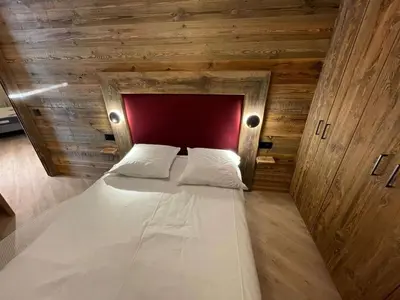 Un ou plusieurs lits dans un hébergement de l'établissement Appartement T3 - ski aux pieds - cœur de station