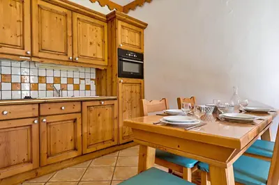 Cuisine ou kitchenette dans l'établissement Mouflon, 4/6 personnes piscine, Spa
