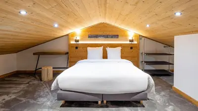Un ou plusieurs lits dans un hébergement de l'établissement Spacieux appt BELLE PLAGNE 6-8 pers SAUNA
