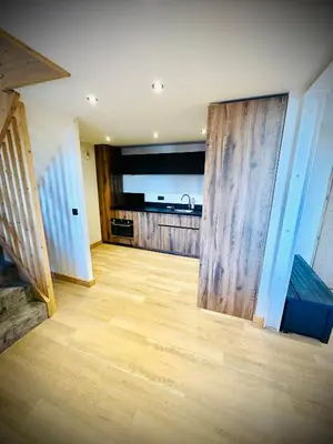 Cuisine ou kitchenette dans l'établissement Spacieux appt BELLE PLAGNE 6-8 pers SAUNA