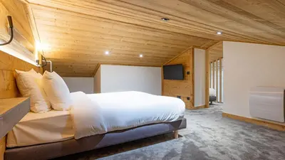 Un ou plusieurs lits dans un hébergement de l'établissement Spacieux appt BELLE PLAGNE 6-8 pers SAUNA