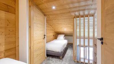 Un ou plusieurs lits dans un hébergement de l'établissement Spacieux appt BELLE PLAGNE 6-8 pers SAUNA