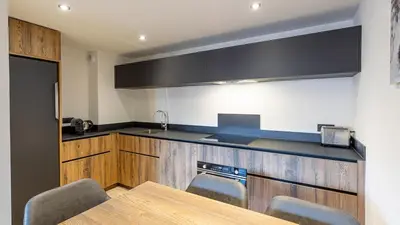 Cuisine ou kitchenette dans l'établissement Spacieux appt BELLE PLAGNE 6-8 pers SAUNA
