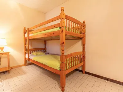 Un ou plusieurs lits dans un hébergement de l'établissement Appartement spacieux, centre village, animaux acceptés - FR-1-840-3