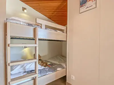 Un ou plusieurs lits dans un hébergement de l'établissement Studio confortable 4 pers avec terrasse, animaux admis et WiFi gratuit - FR-1-840-9