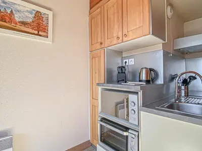 Cuisine ou kitchenette dans l'établissement Studio confortable 4 pers avec terrasse, animaux admis et WiFi gratuit - FR-1-840-9