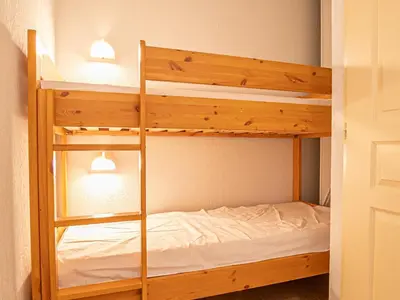 Un ou plusieurs lits dans un hébergement de l'établissement Confortable duplex 2 pièces au pied des pistes avec parking - FR-1-840-17