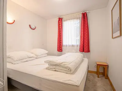 Un ou plusieurs lits dans un hébergement de l'établissement Appartement cosy au pied des pistes avec animaux admis - FR-1-840-27