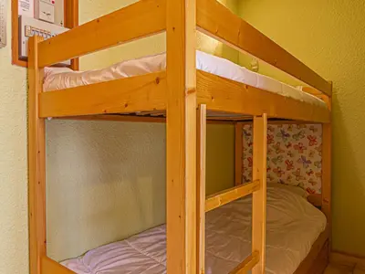 Un ou plusieurs lits dans un hébergement de l'établissement Studio fonctionnel avec balcon pour 3 personnes - FR-1-840-36