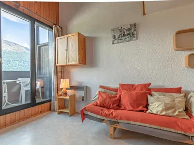 Coin salon dans l'établissement Appartement mezzanine pour 4 pers, proche des remontées - FR-1-840-45