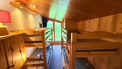 Un ou plusieurs lits dans un hébergement de l'établissement Superbe Duplex Centre Station