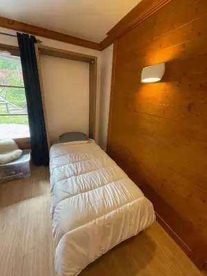 Un ou plusieurs lits dans un hébergement de l'établissement Cozy studio 3 guests, private terrace, inside pool, spa, luxurious residence, ski-in ski-out