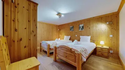 Un ou plusieurs lits dans un hébergement de l'établissement Chalet La Becquetta