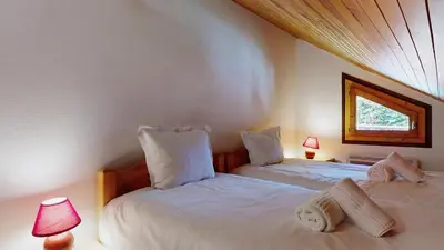Un ou plusieurs lits dans un hébergement de l'établissement Chalet La Becquetta