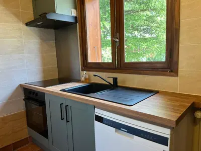 Cuisine ou kitchenette dans l'établissement La BARTAVELLE
