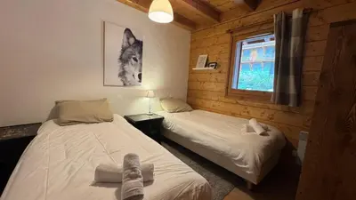 Un ou plusieurs lits dans un hébergement de l'établissement Chaleureux appartement 10pers Sainte-Foy-Station