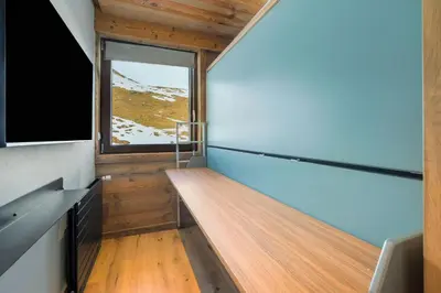 Télévision ou salle de divertissement dans l'établissement Appartement Le Névé - Vue lac