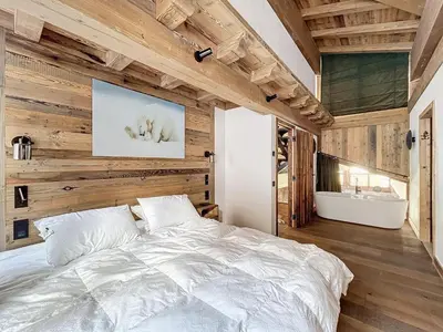 Un ou plusieurs lits dans un hébergement de l'établissement Appartement spacieux 4 chambres avec WIFI à Val-d'Isère - FR-1-519-42