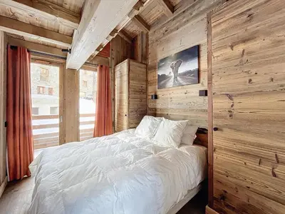 Un ou plusieurs lits dans un hébergement de l'établissement Appartement spacieux 4 chambres avec WIFI à Val-d'Isère - FR-1-519-42