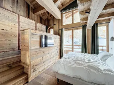 Un ou plusieurs lits dans un hébergement de l'établissement Appartement spacieux 4 chambres avec WIFI à Val-d'Isère - FR-1-519-42
