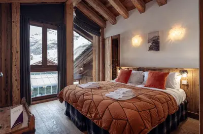 Un ou plusieurs lits dans un hébergement de l'établissement Madame Vacances Chalet Genepy