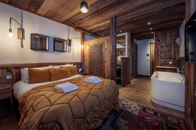 Un ou plusieurs lits dans un hébergement de l'établissement Madame Vacances Chalet Genepy