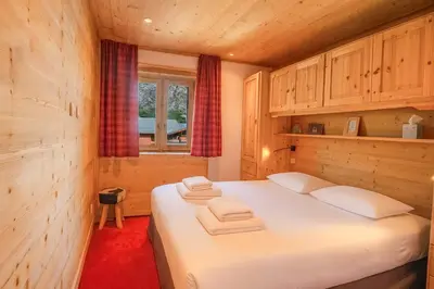 Un ou plusieurs lits dans un hébergement de l'établissement Superbe appartement lumineux et spacieux au coeur de Val d'Isère