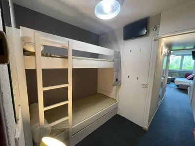 Un ou plusieurs lits dans un hébergement de l'établissement Appartement confortable ARCS 2000 pour 5 personnes