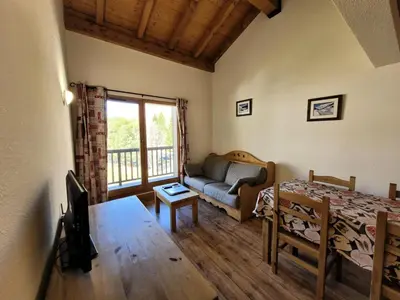 Coin salon dans l'établissement Résidence Le Clos Vanoise - 3 Pièces pour 8 Personnes MAE-1873