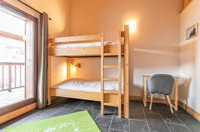 Un ou plusieurs lits dans un hébergement de l'établissement Résidence Le Criterium - Résidence Le Critérium 3Chalet E Appartement 7 MAE-1963
