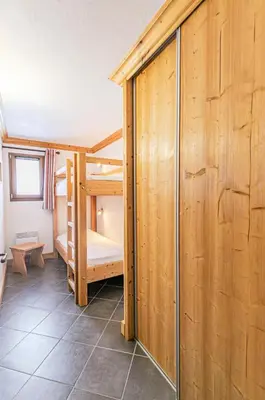 Un ou plusieurs lits dans un hébergement de l'établissement Résidence Le Criterium - Résidence Le Critérium 3Chalet D Appartement 12 MAE-2003