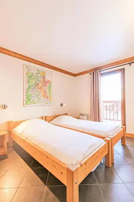 Un ou plusieurs lits dans un hébergement de l'établissement Résidence Le Criterium - Résidence Le Critérium 3Chalet D Appartement 11 MAE-2043