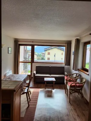 Coin salon dans l'établissement Résidence Les Balcons Des Curtious - Appartement 2 pièces coin montagne - 4 personnes MAE-2103