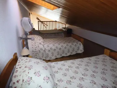 Un ou plusieurs lits dans un hébergement de l'établissement Résidence Les Balcons Des Curtious - Studio mezzanine - 4 personnes MAE-2113