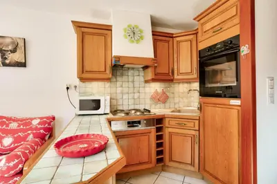 Cuisine ou kitchenette dans l'établissement Résidence Les Balcons Des Curtious - Appartement 2 pièces - 6 personnes MAE-2173