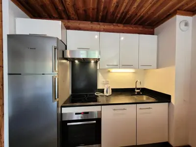 Cuisine ou kitchenette dans l'établissement Résidence La Bergerie - Très bel appartement vue sur pistes MAE-2213