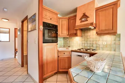 Cuisine ou kitchenette dans l'établissement Résidence Les Balcons Des Curtious - Appartement 4 pièces - 8 personnes MAE-2393